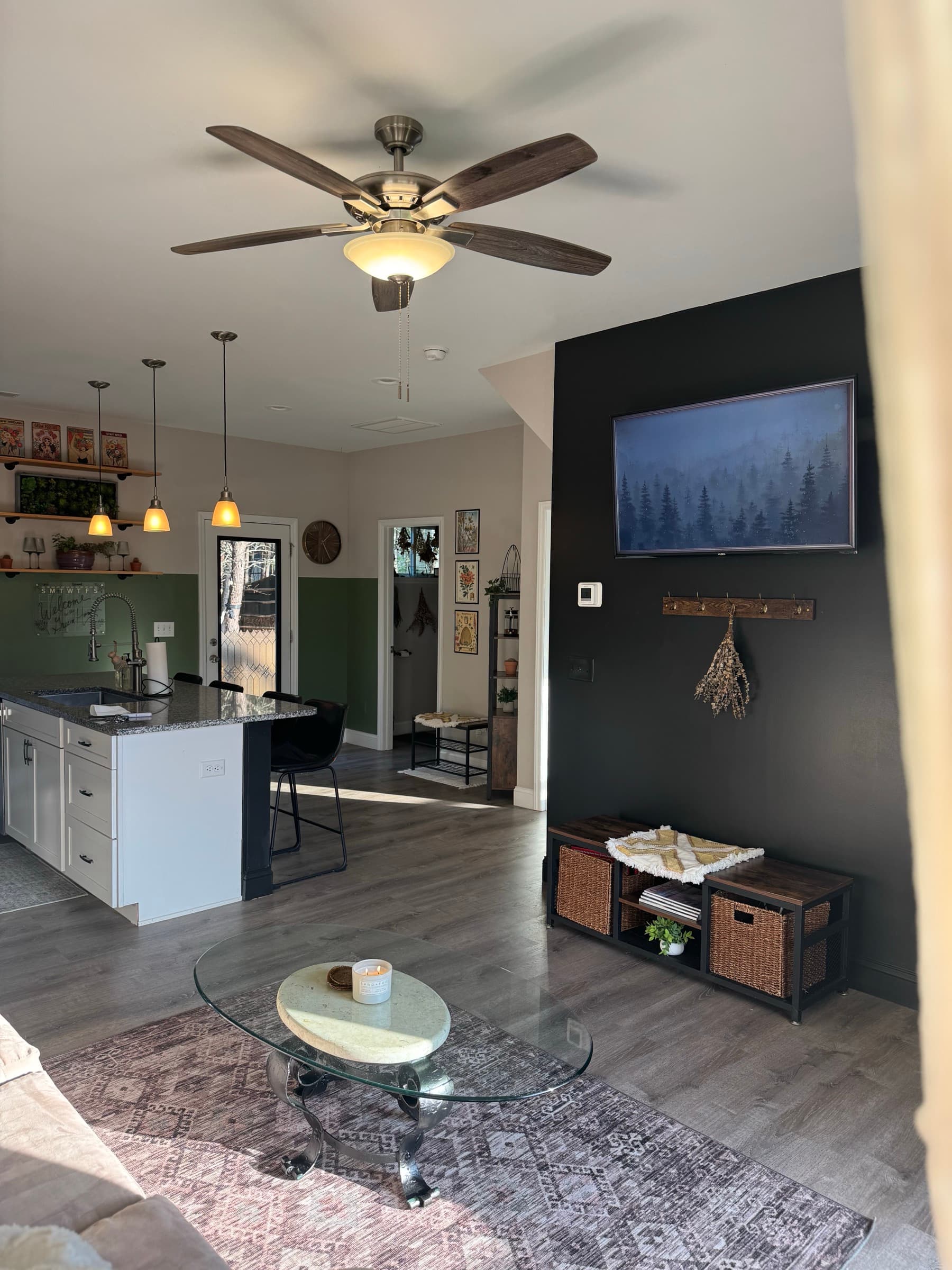 Open living room and kitchen with island seating and bright finishes